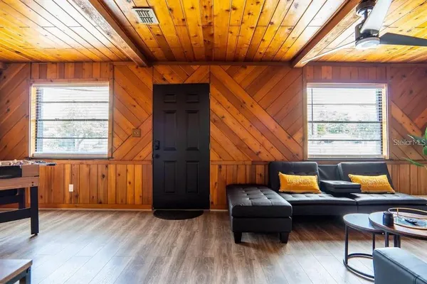 a living room with furniture and a window