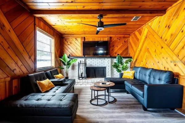 a outdoor living space with patio furniture and a fireplace