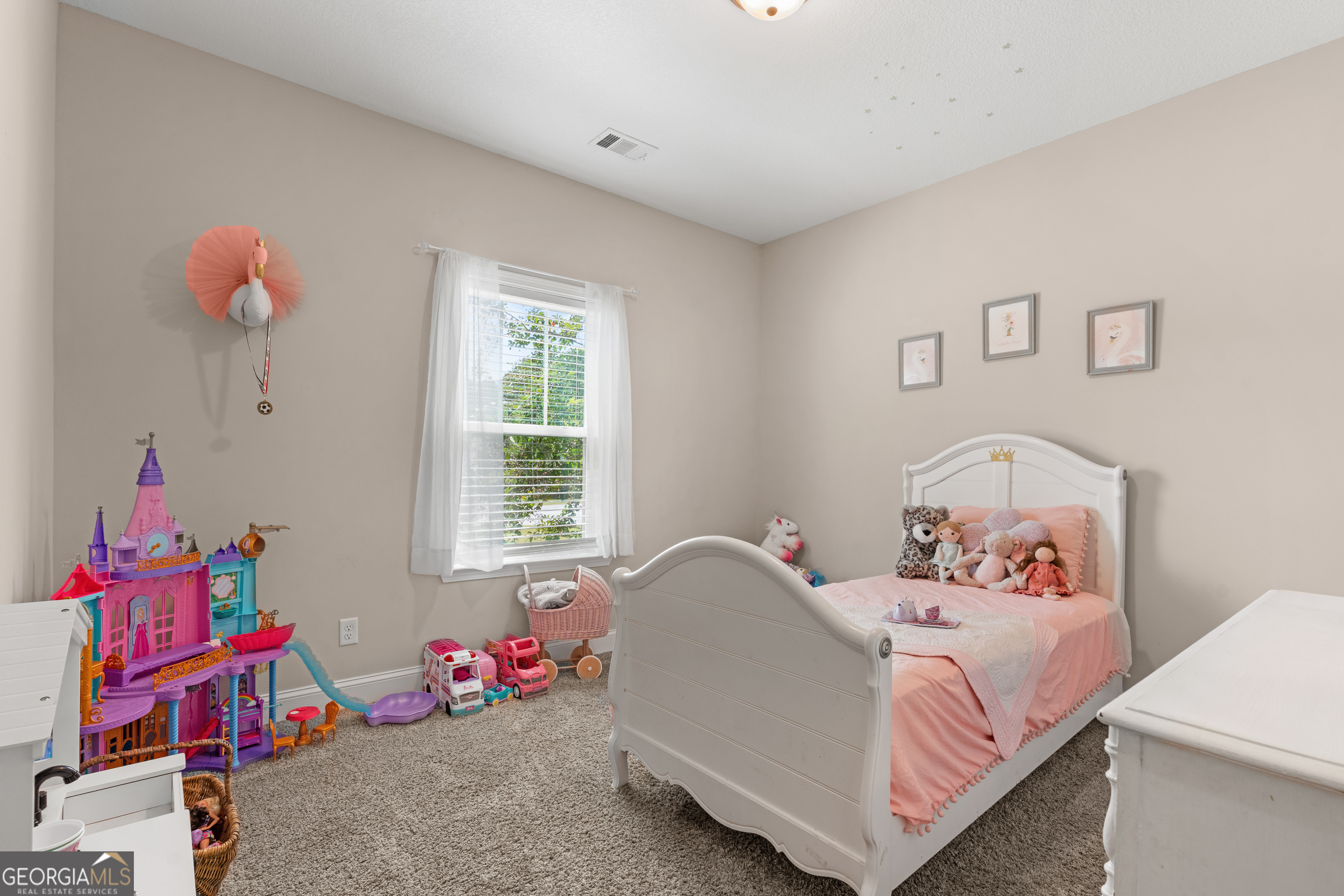 321 Farmington Road Statesboro, GA 30458 - Photo 17 of 24 a bedroom with a bed and a window