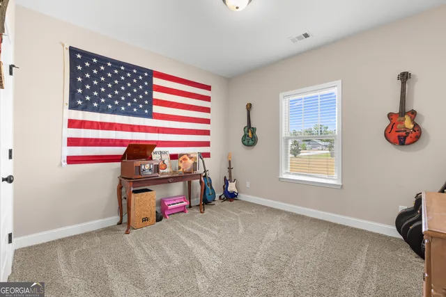 a living room with a couch and a window