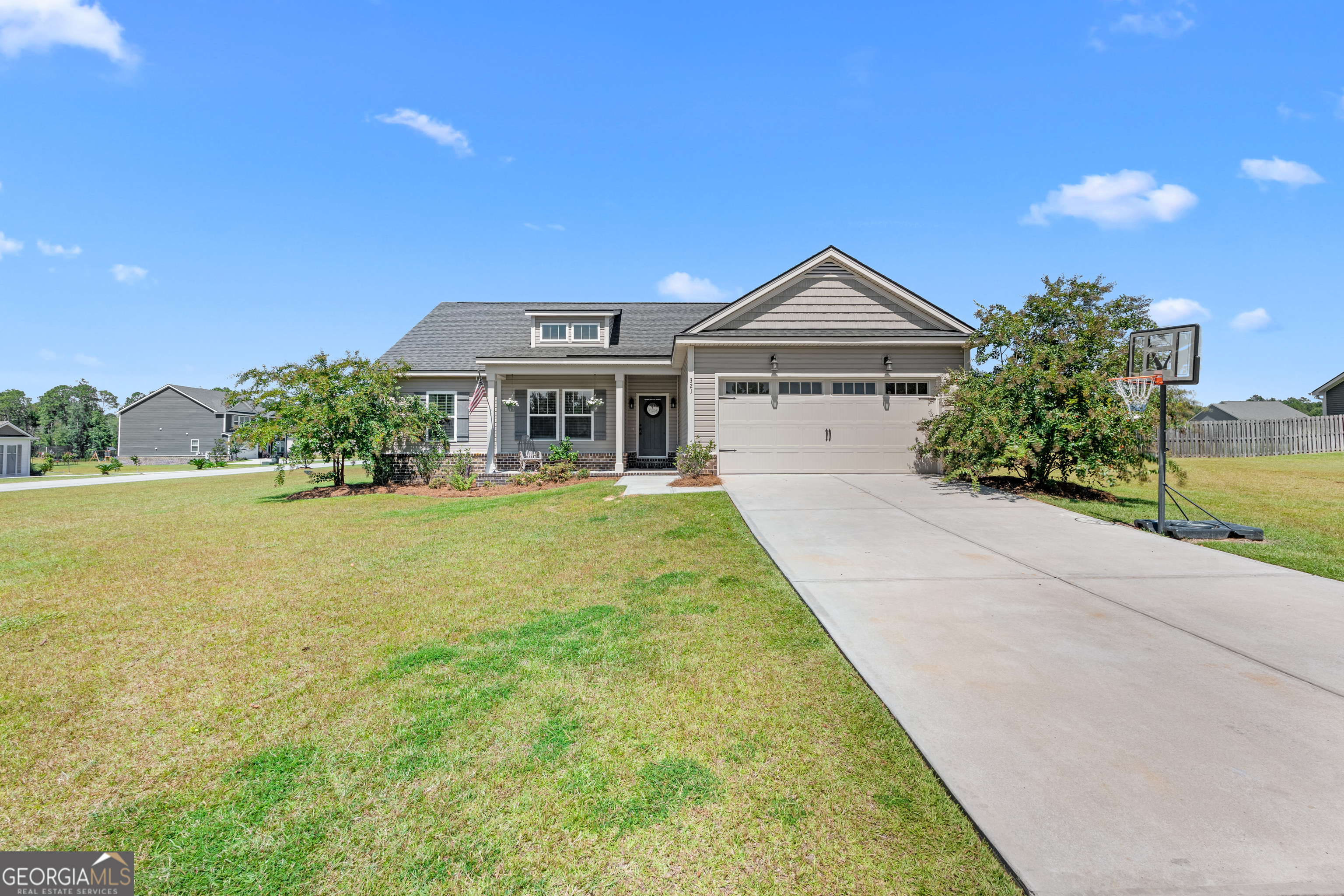 321 Farmington Road Statesboro, GA 30458 - Photo 2 of 24 a front view of a house with yard and green space