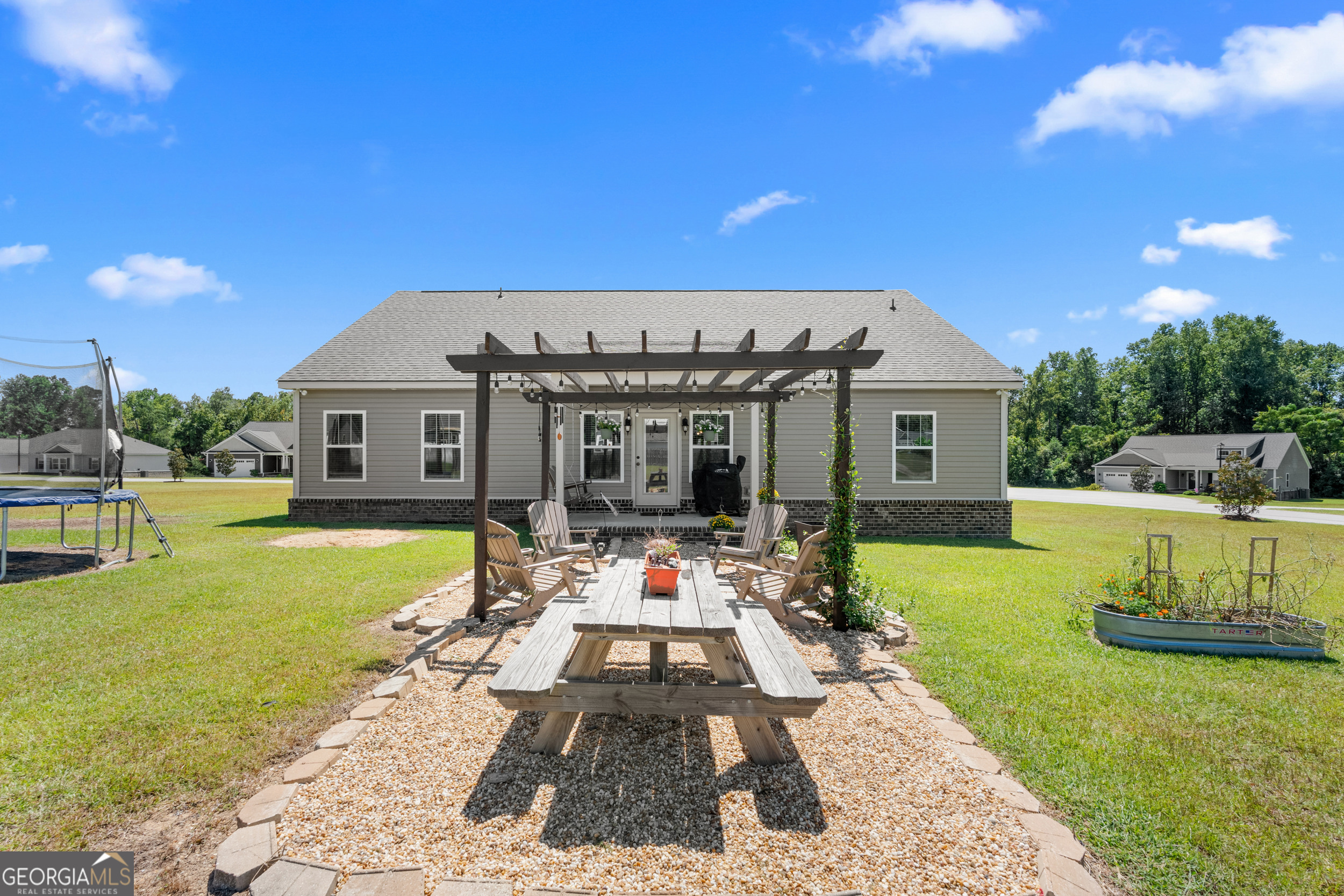 321 Farmington Road Statesboro, GA 30458 - Photo 22 of 24 a front view of a house with swimming pool having outdoor seating