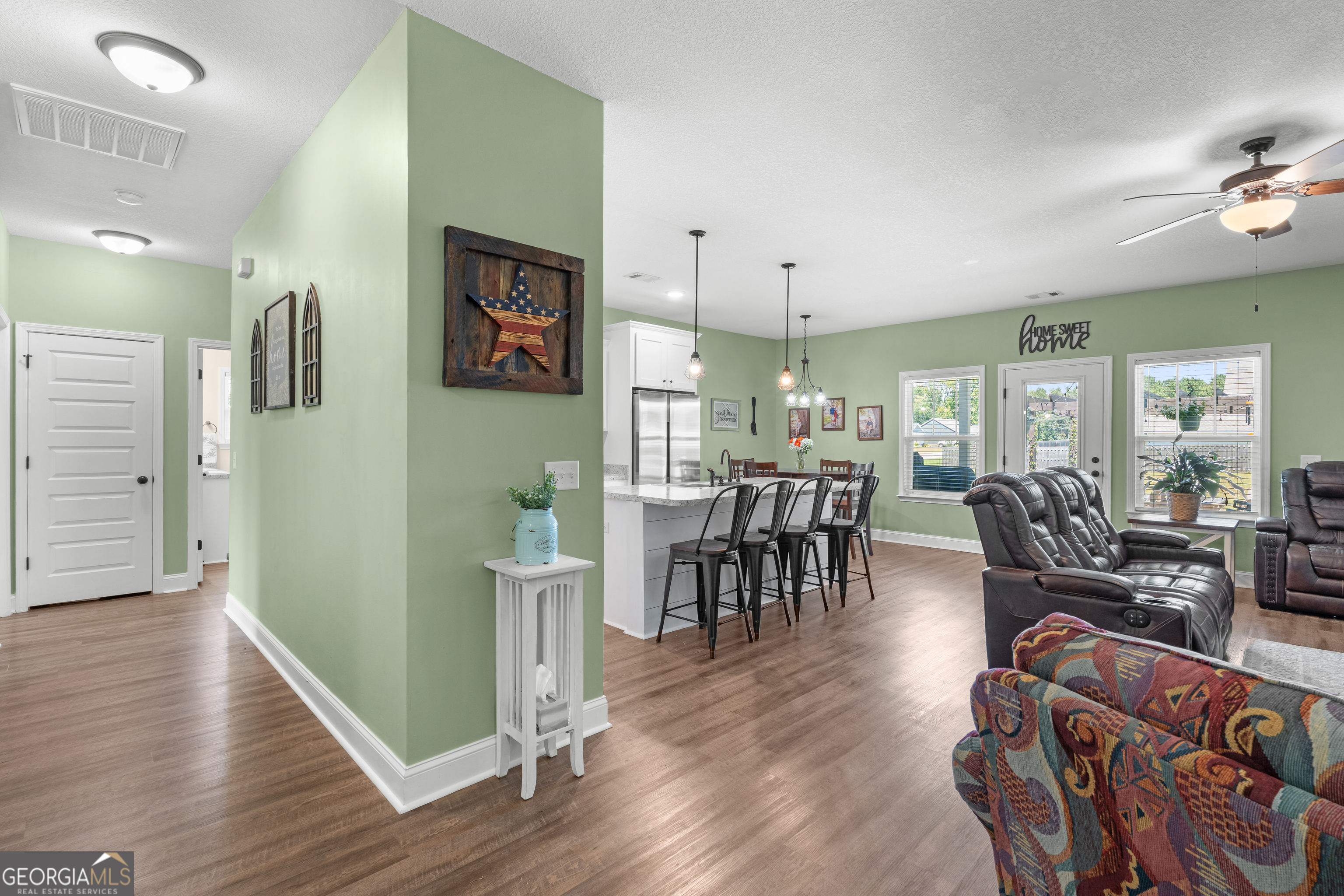 321 Farmington Road Statesboro, GA 30458 - Photo 6 of 24 a living room with furniture and a wooden floor