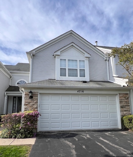 4716 Amber Circle Hoffman Estates, IL 60192 - Photo 1 of 14 a front view of a house with a yard and garage
