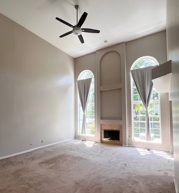 4716 Amber Circle Hoffman Estates, IL 60192 - Photo 3 of 14 a view of a livingroom with a fireplace and window