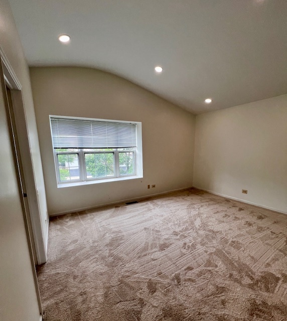 4716 Amber Circle Hoffman Estates, IL 60192 - Photo 9 of 14 an empty room with windows