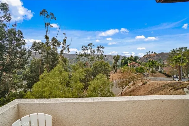 a balcony with table and chairs