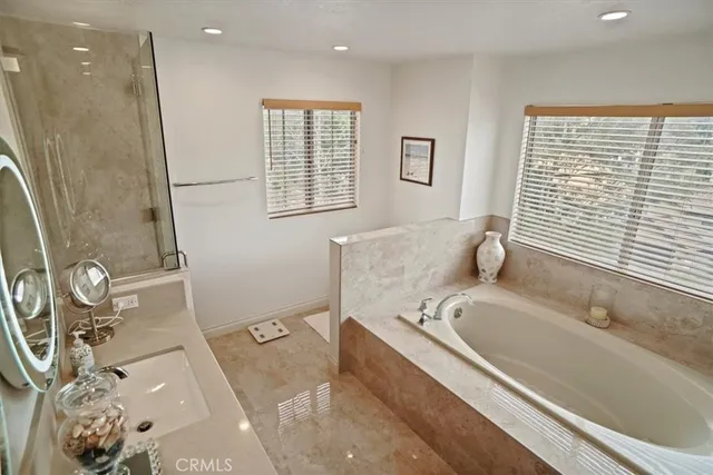 a bathroom with a sink double vanity and a mirror