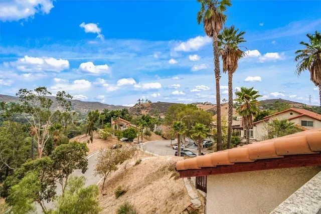 a view of a chairs and table in patio