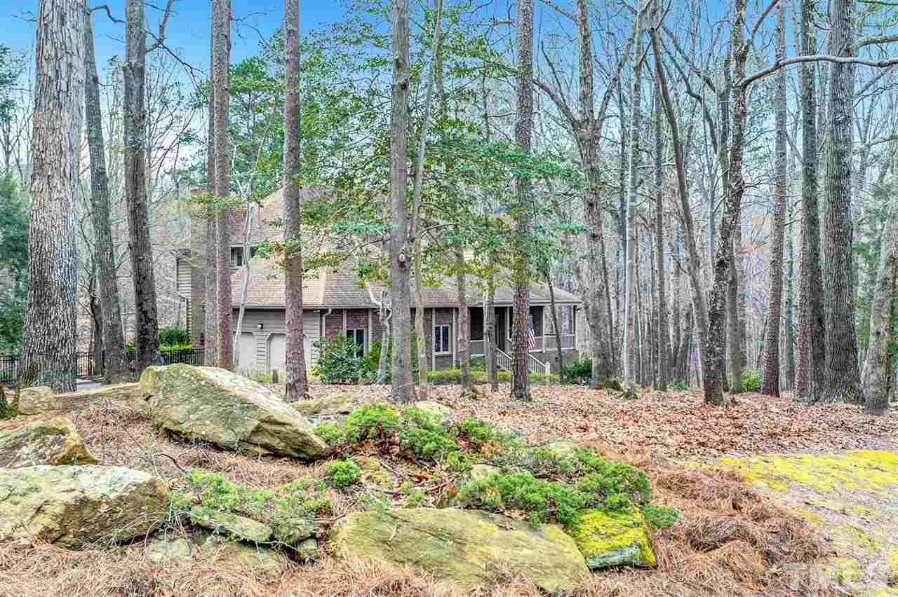 205 Trotters Ridge Drive Raleigh, NC 27614 - Photo 2 of 25 a backyard of a house with large trees and a trees