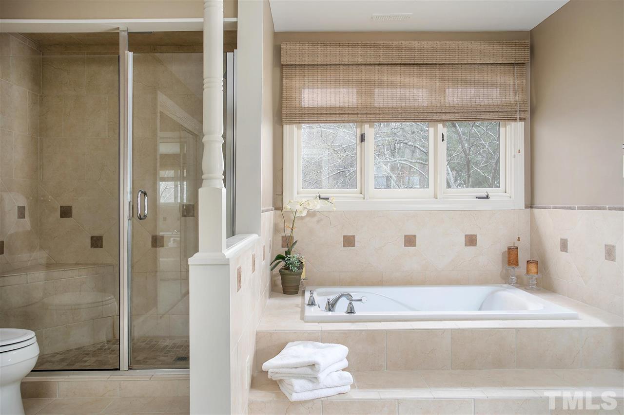 205 Trotters Ridge Drive Raleigh, NC 27614 - Photo 15 of 25 a bathroom with a bathtub and a shower