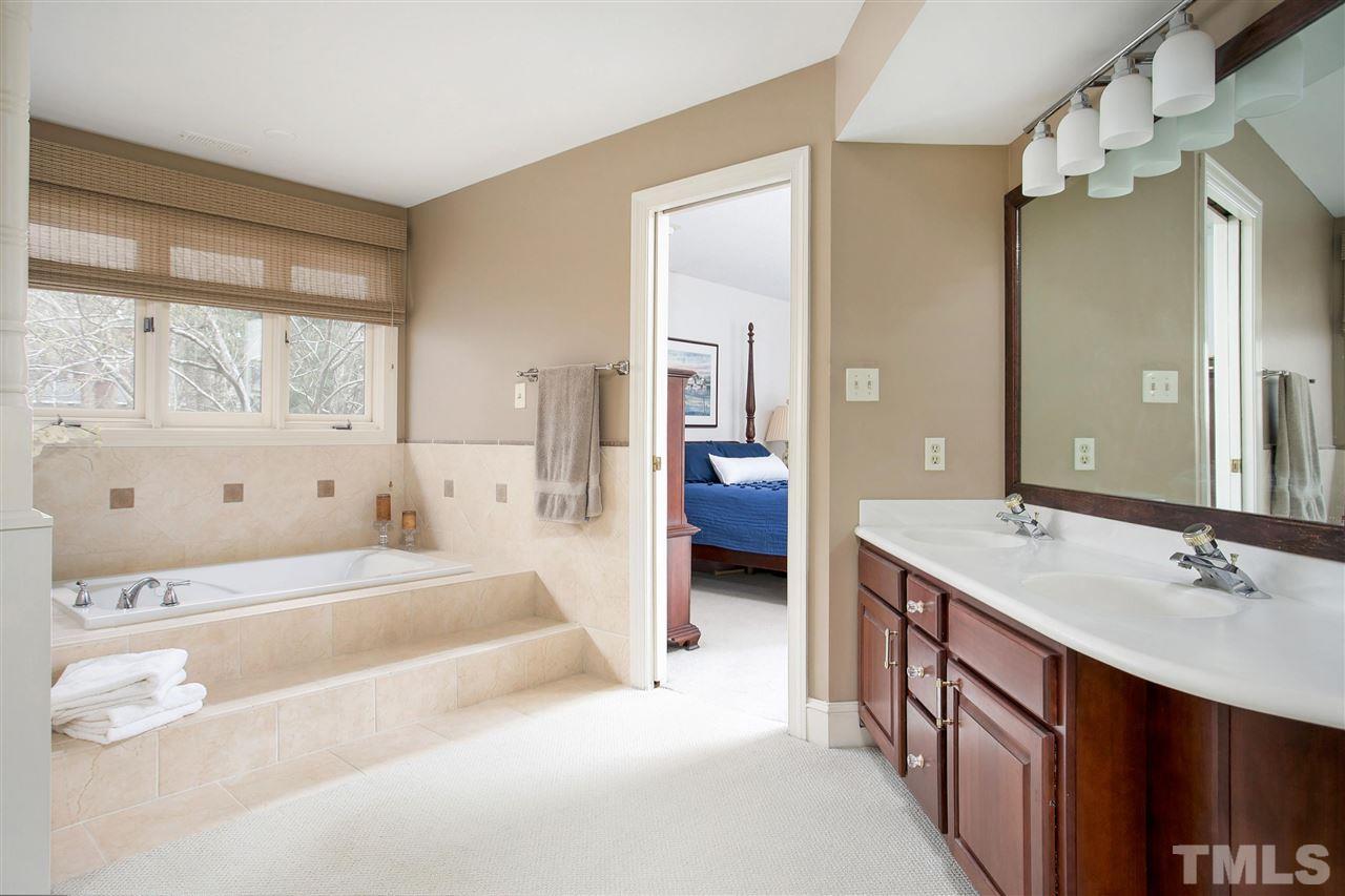 205 Trotters Ridge Drive Raleigh, NC 27614 - Photo 16 of 25 a spacious bathroom with a tub sink and mirror
