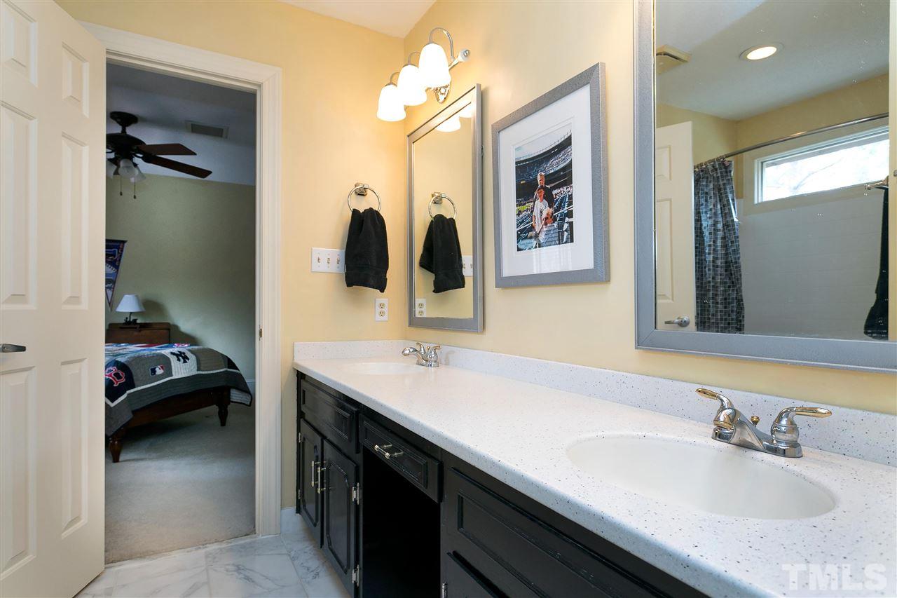 205 Trotters Ridge Drive Raleigh, NC 27614 - Photo 18 of 25 a en suite bathroom with a sink and a mirror