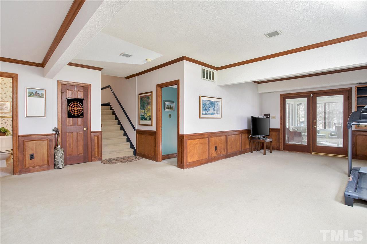 205 Trotters Ridge Drive Raleigh, NC 27614 - Photo 19 of 25 a view of a livingroom with furniture and staircase