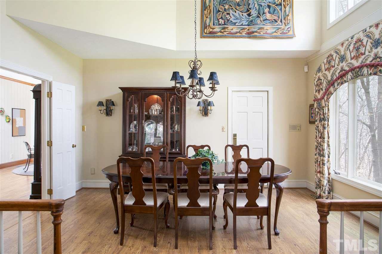 205 Trotters Ridge Drive Raleigh, NC 27614 - Photo 6 of 25 a view of a dining room with furniture and a chandelier