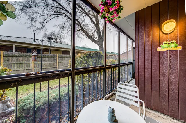 a view of a balcony with wooden floor and outdoor space