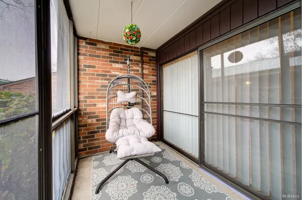 a view of house with swimming pool and sitting area