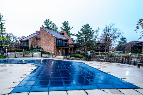 a view of a house with brick walls