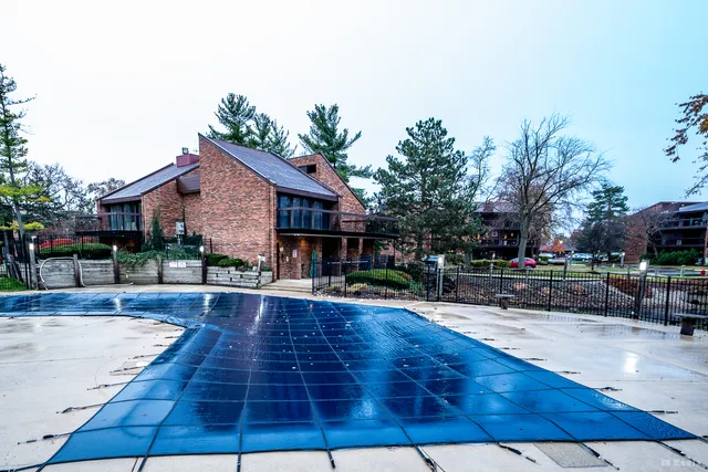 a view of a house with brick walls