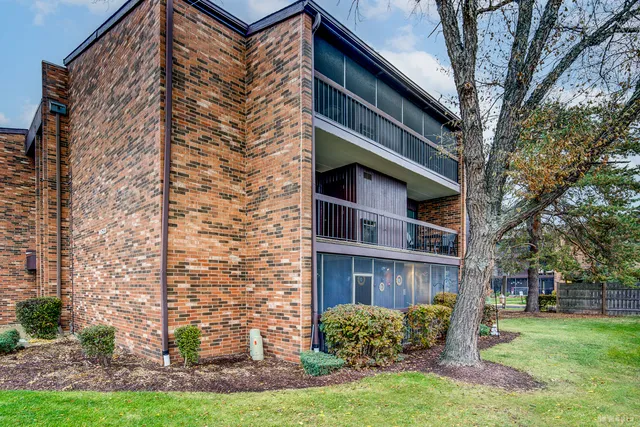 a view of a building with a yard