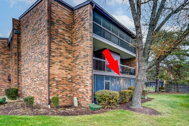 a red brick building with trees in front of it
