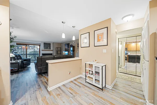 a room with furniture a wooden floor and a window
