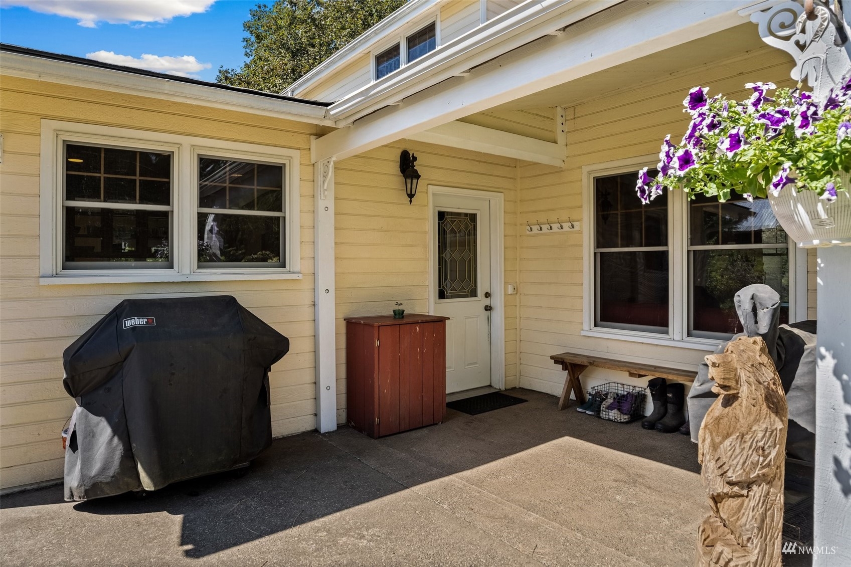 1295 Ferrier Road Winlock, WA 98596 - Photo 21 of 39 a front view of a house with a potted plant and a large window