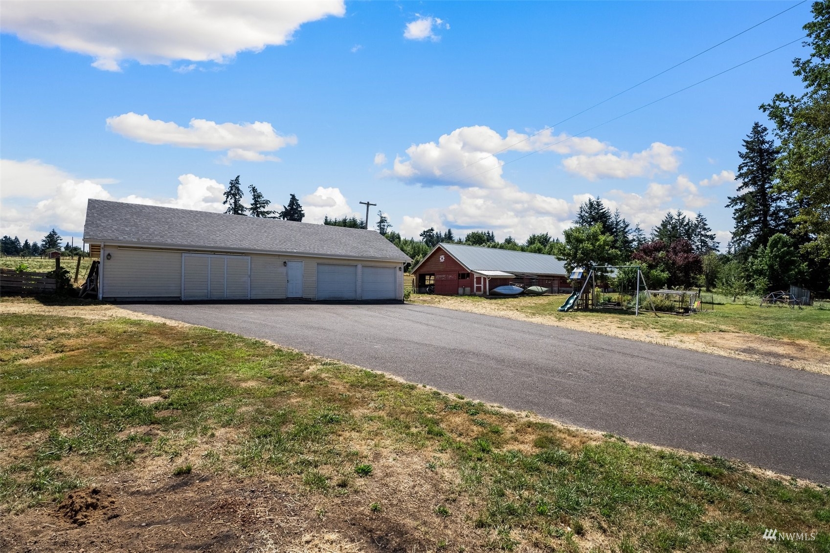 1295 Ferrier Road Winlock, WA 98596 - Photo 36 of 39 a view of a big room with a big yard and a large tree