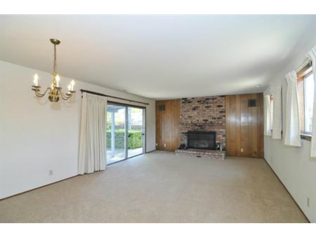 15308 Woodard Road San Jose, CA 95124 - Photo 3 of 10 a view of empty room with a fireplace