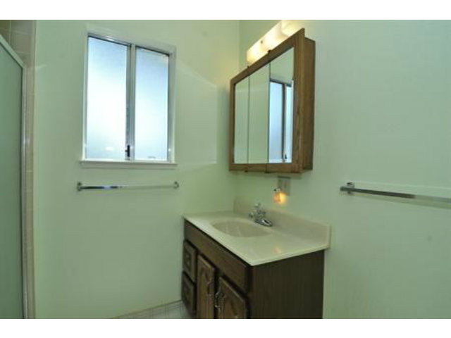 15308 Woodard Road San Jose, CA 95124 - Photo 6 of 10 a bathroom with a sink and a mirror