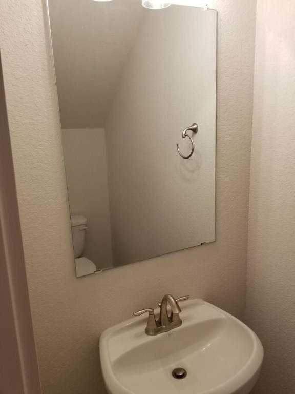 2500 Forest Creek Drive, Unit 603 Round Rock, TX 78665 - Photo 11 of 16 a bathroom with a sink and mirror