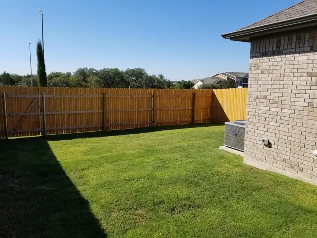 a view of a backyard with a small cabin
