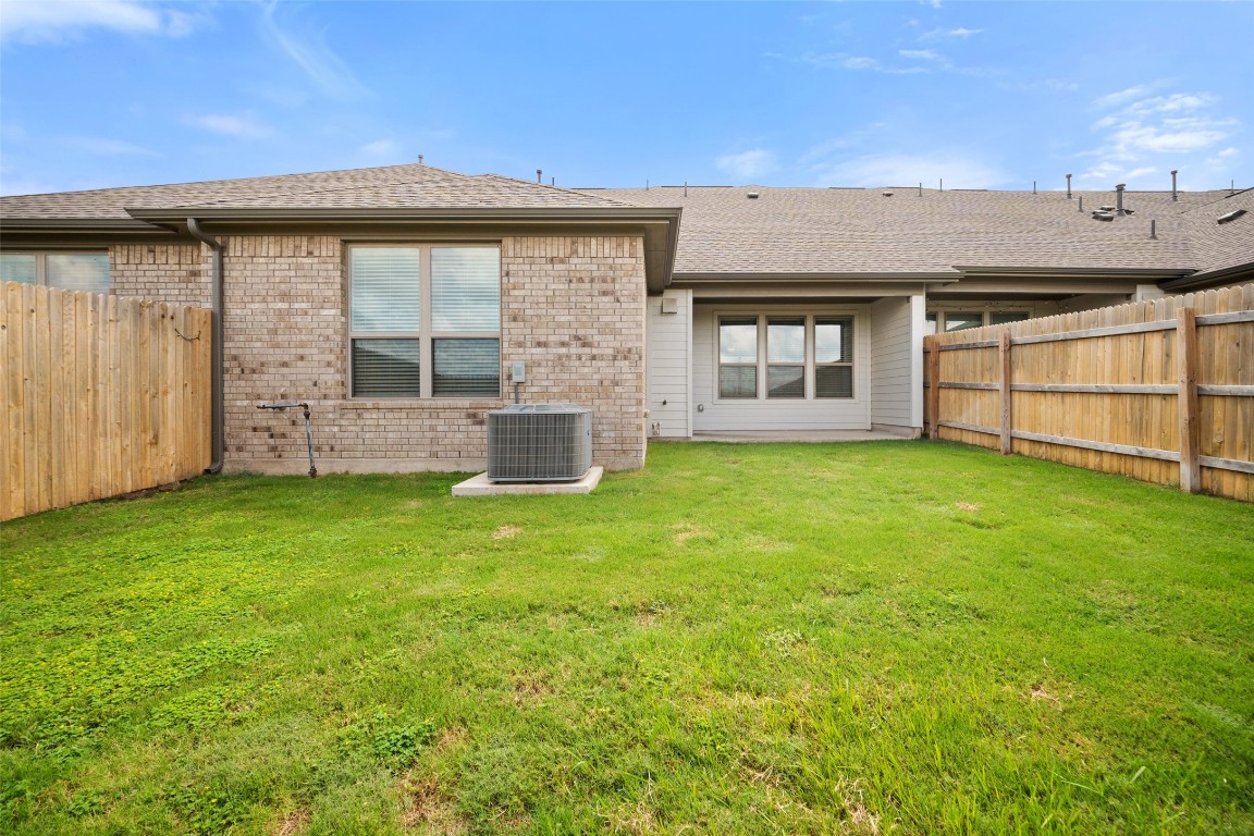 2500 Forest Creek Drive, Unit 603 Round Rock, TX 78665 - Photo 16 of 16 front view of a house with a yard