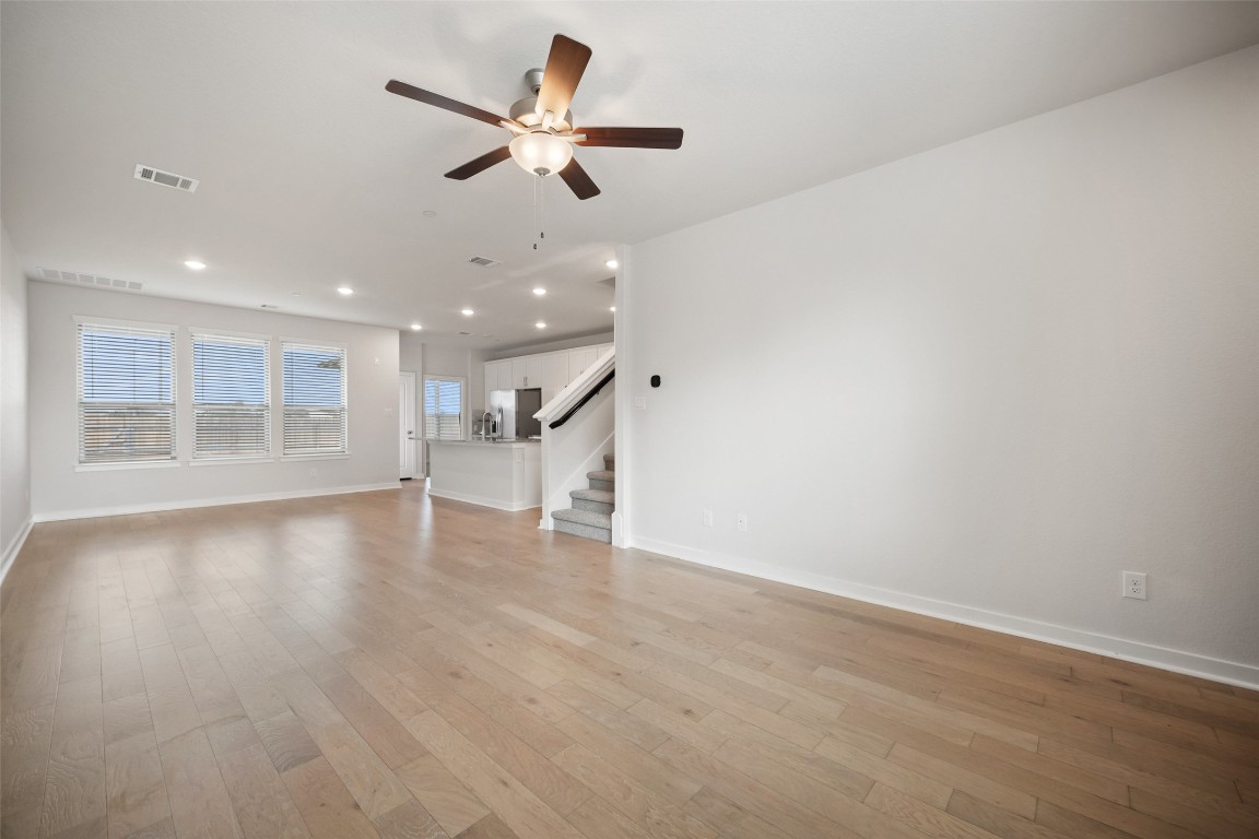 2500 Forest Creek Drive, Unit 603 Round Rock, TX 78665 - Photo 3 of 16 an empty room with wooden floor and windows