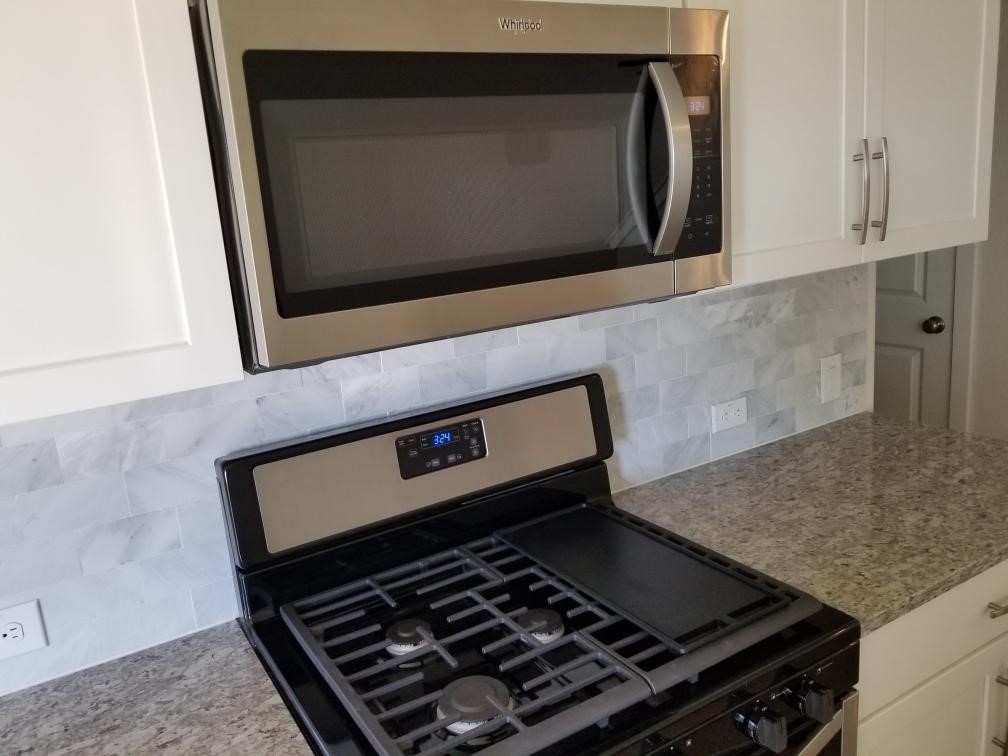 2500 Forest Creek Drive, Unit 603 Round Rock, TX 78665 - Photo 6 of 16 a stove top oven sitting inside of a kitchen
