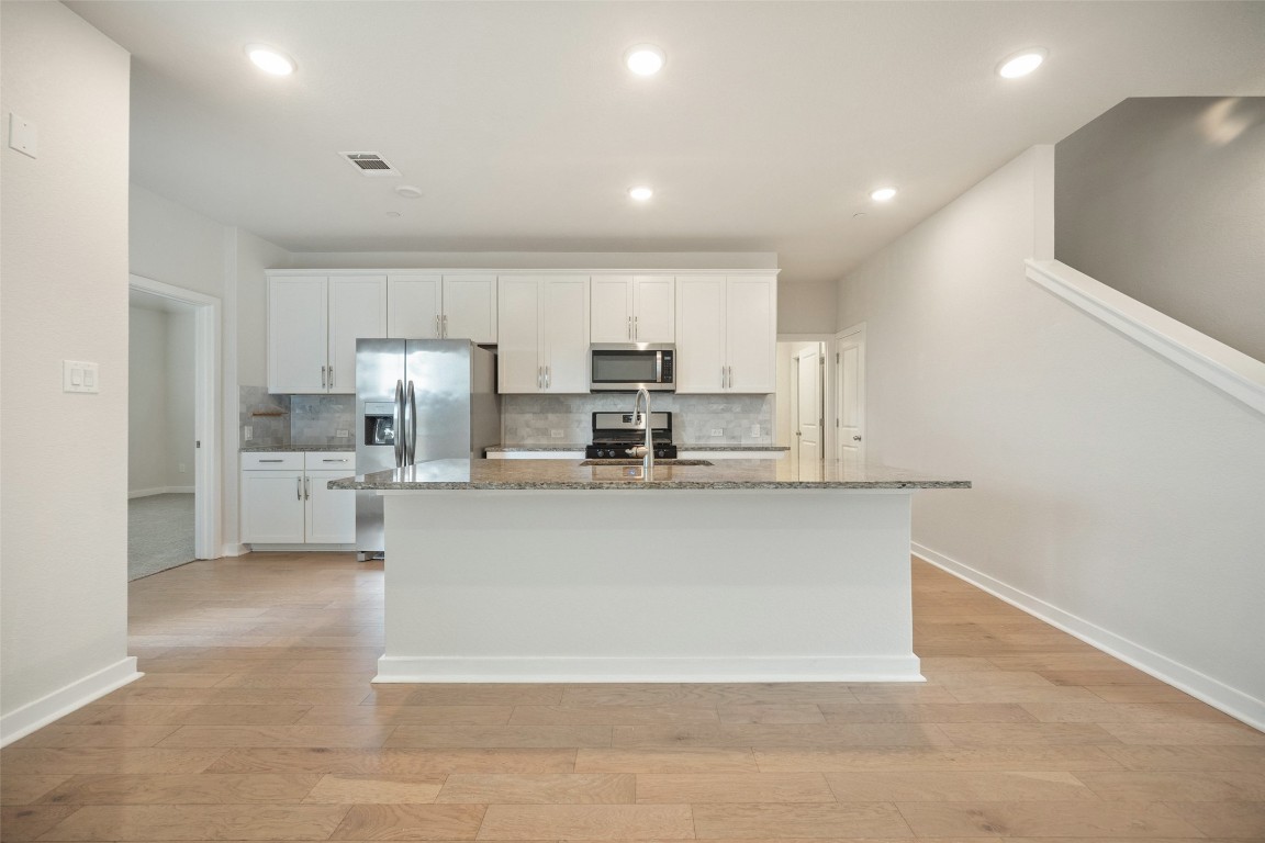2500 Forest Creek Drive, Unit 603 Round Rock, TX 78665 - Photo 10 of 16 a view of kitchen with stainless steel appliances cabinets