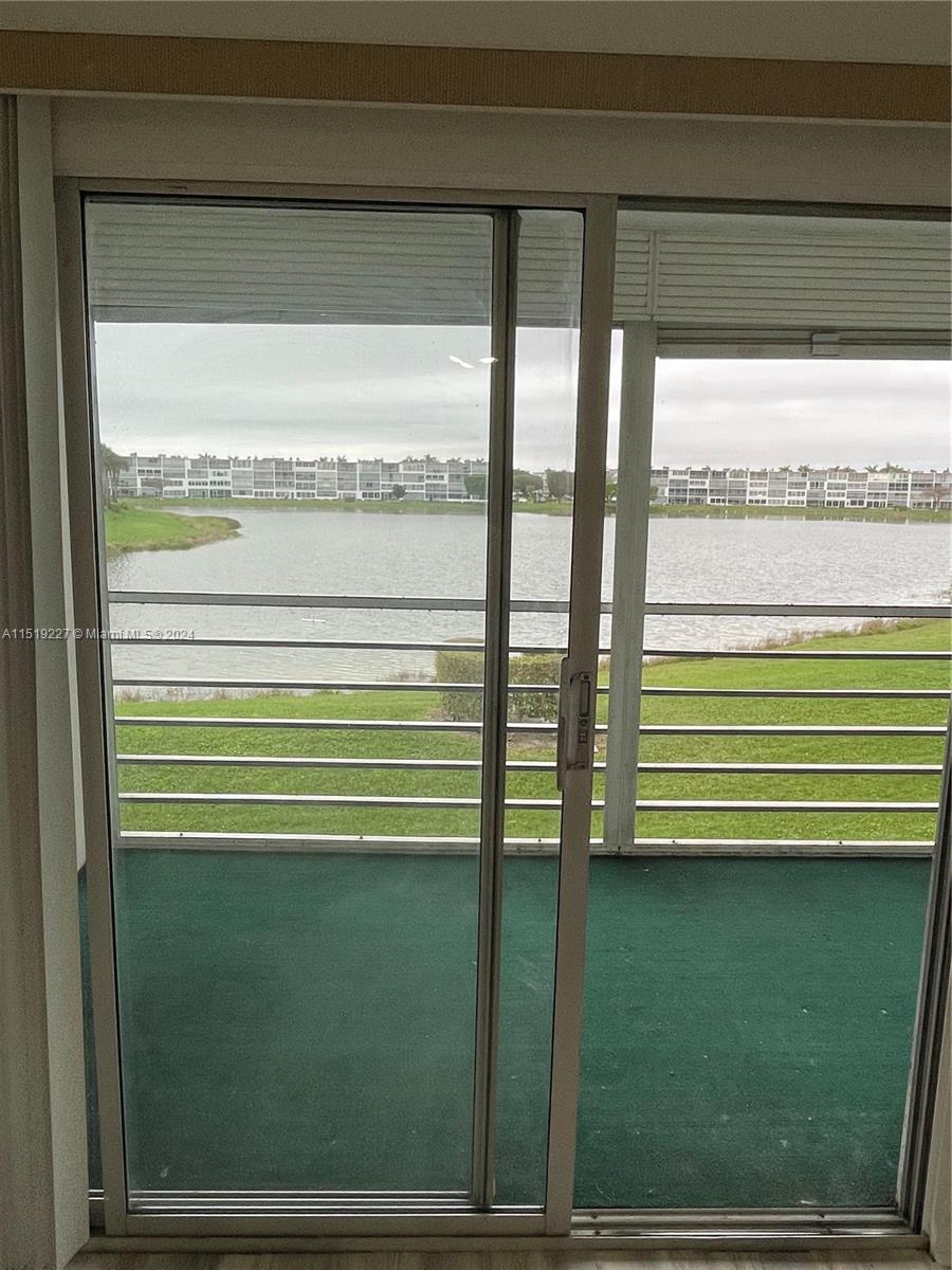 2085 Exeter, Unit 2085 Boca Raton, FL 33434 - Photo 13 of 31 a view of a green space from a window