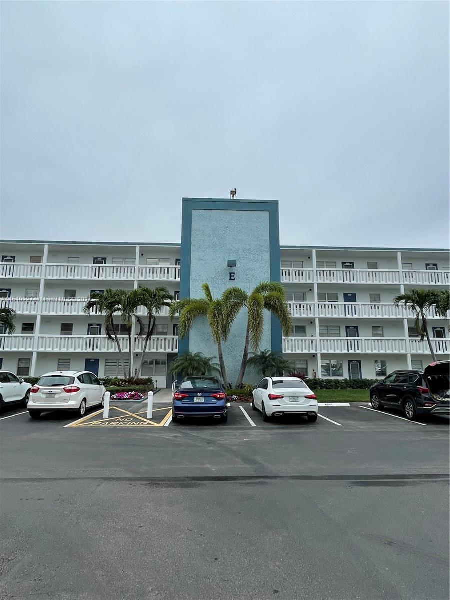 2085 Exeter, Unit 2085 Boca Raton, FL 33434 - Photo 23 of 31 a car parked in front of a building