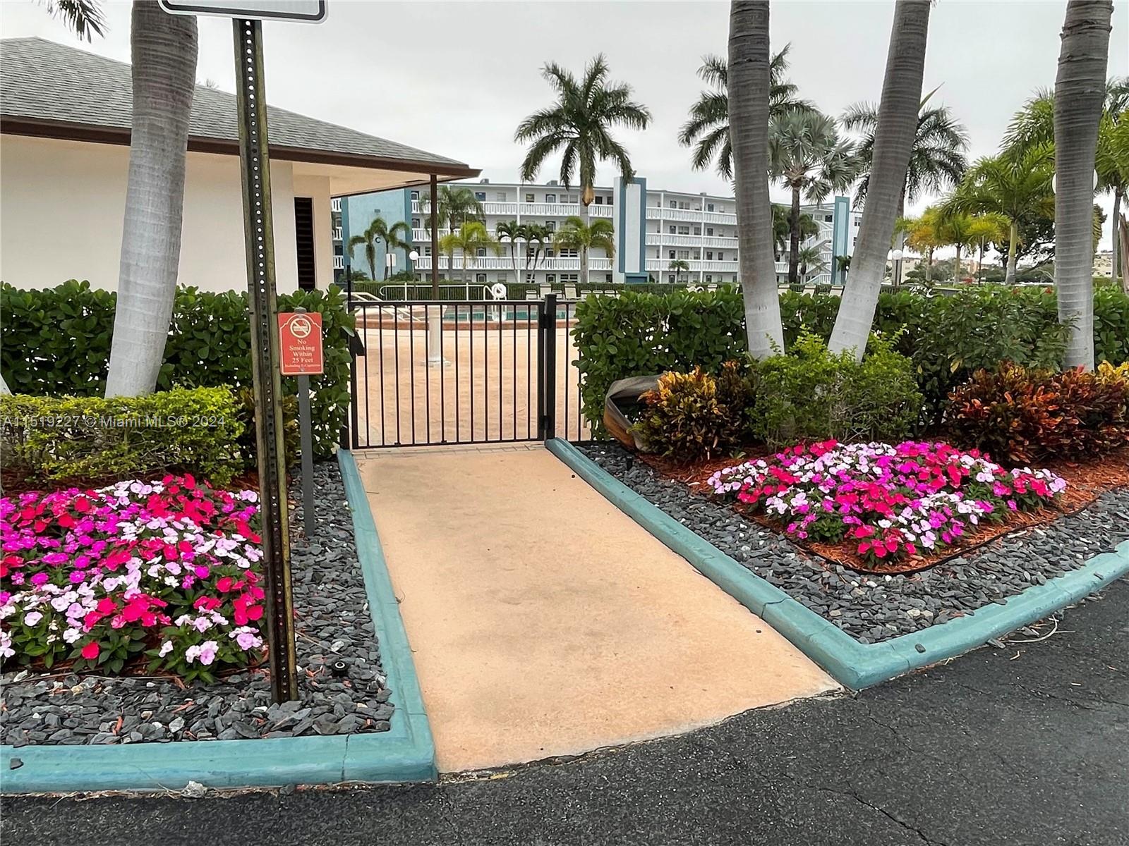 2085 Exeter, Unit 2085 Boca Raton, FL 33434 - Photo 27 of 31 a front view of a house having yard