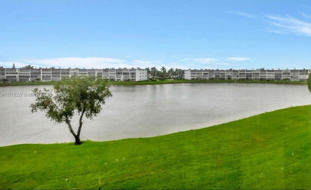 2085 Exeter, Unit 2085 Boca Raton, FL 33434 - Photo 4 of 31 a view of a lake with a city