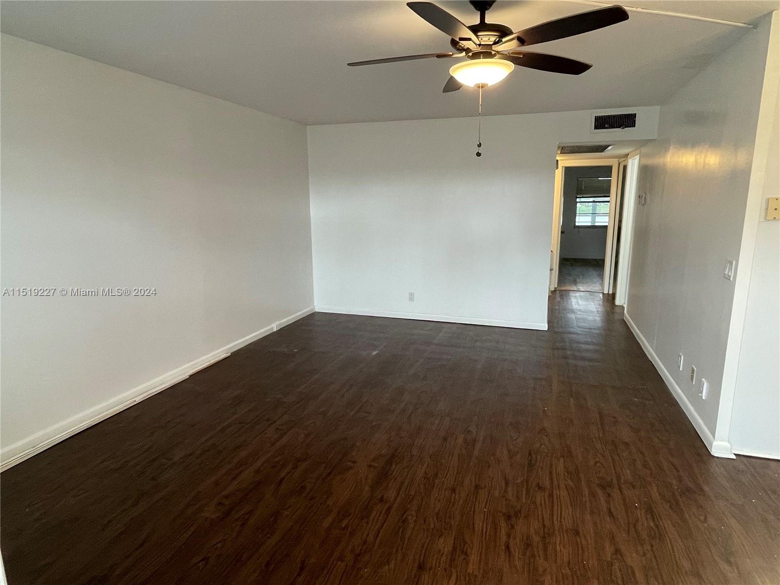 2085 Exeter, Unit 2085 Boca Raton, FL 33434 - Photo 5 of 31 wooden floor in an empty room