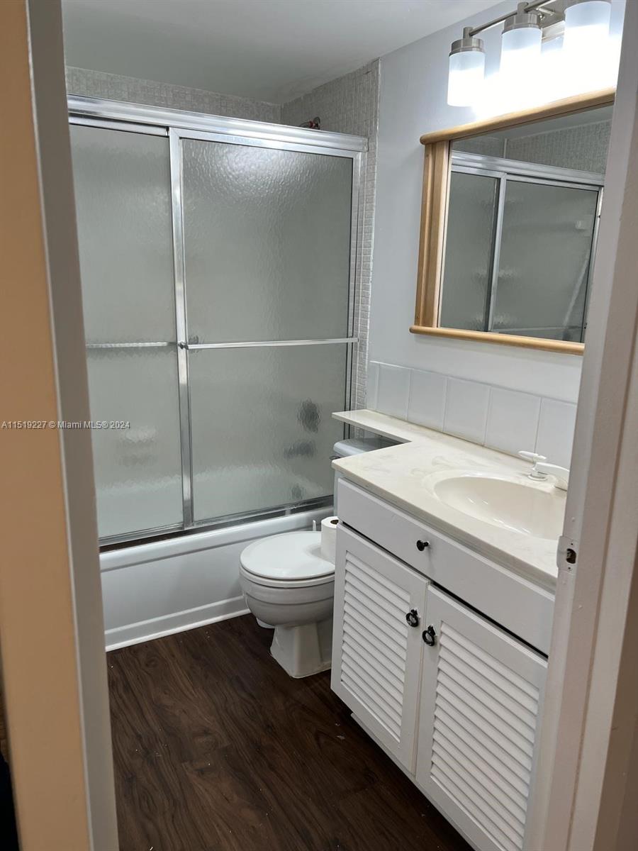 2085 Exeter, Unit 2085 Boca Raton, FL 33434 - Photo 9 of 31 a bathroom with a toilet a sink and shower