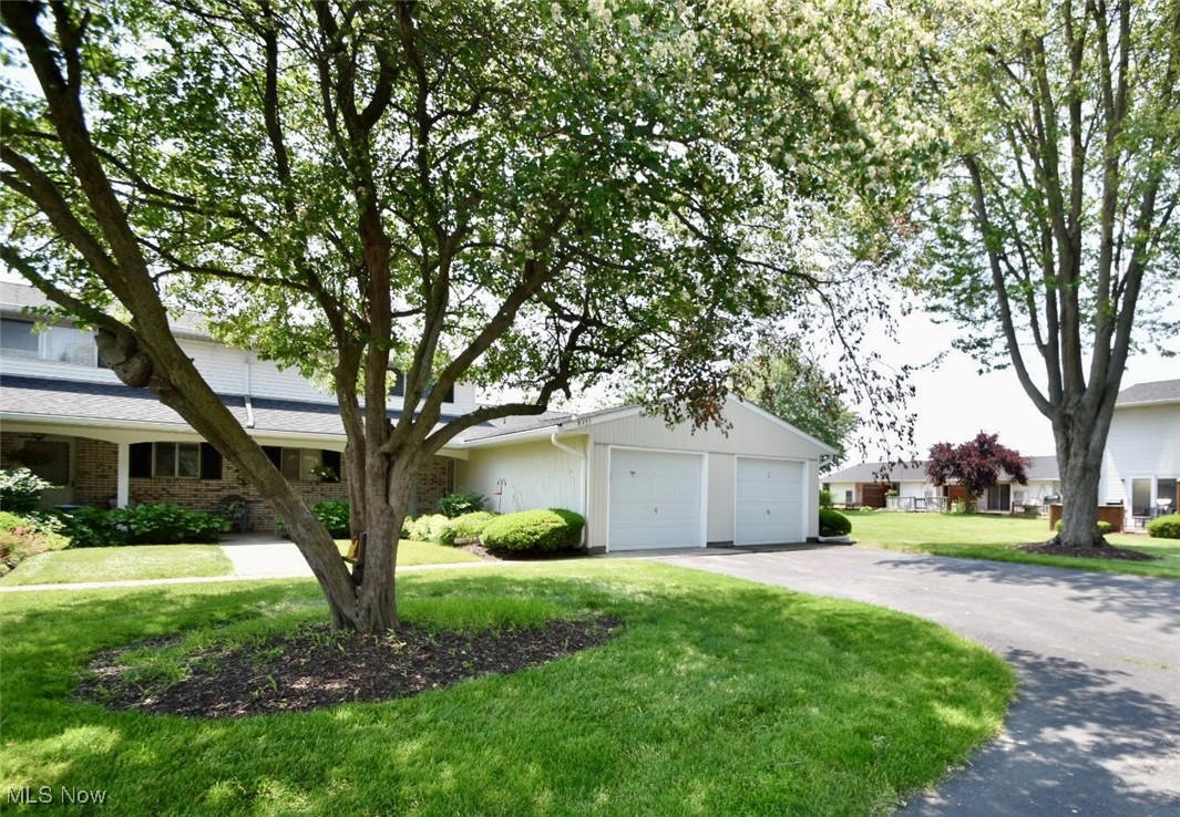 8955 West Ridge Road, Unit D Elyria, OH 44035 - Photo 1 of 33 View of front of house with a front yard and a garage