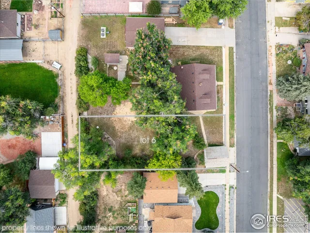 an aerial view of a house with a garden and plants