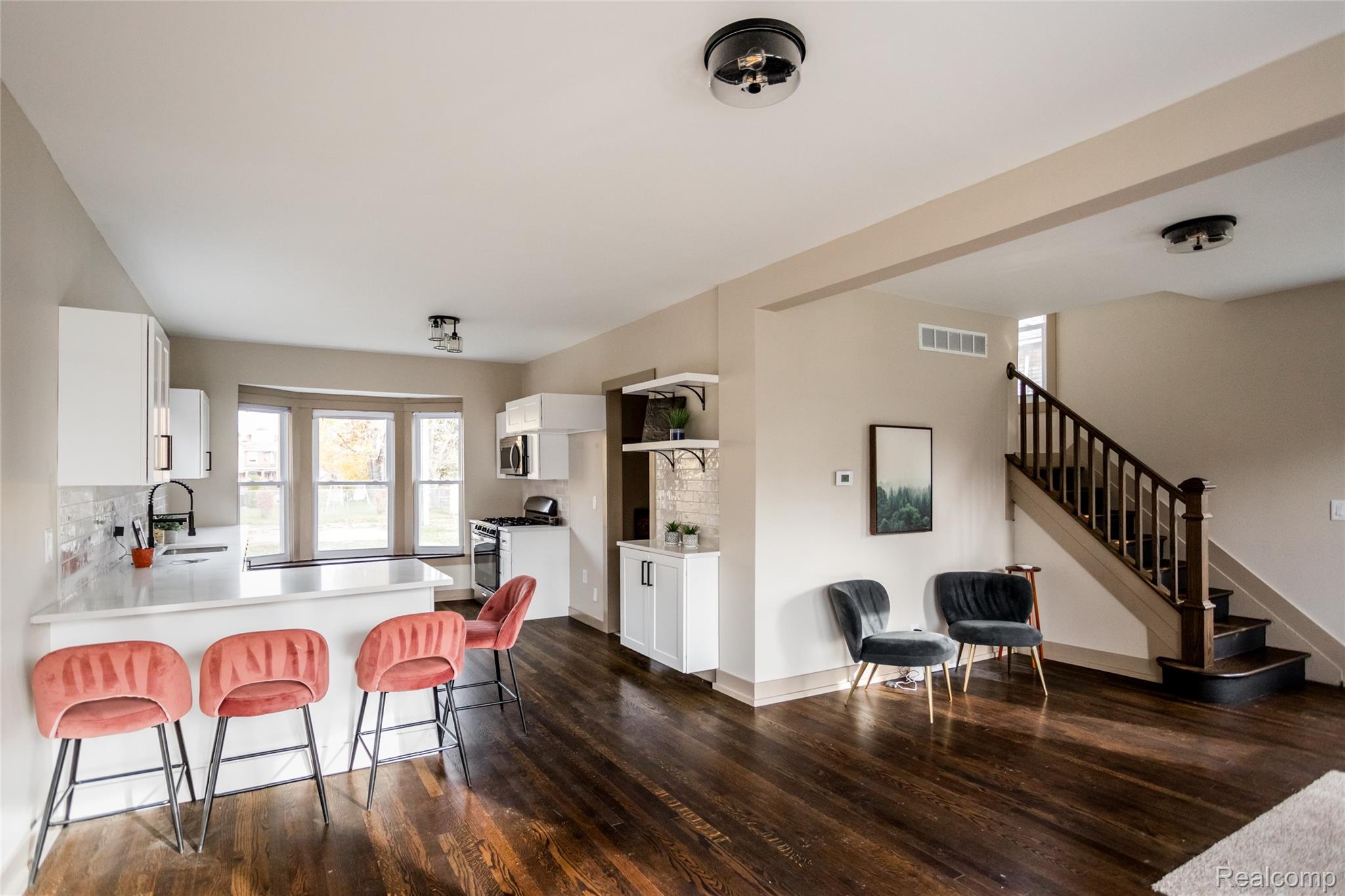 2630 Harding Street Detroit, MI 48214 - Photo 6 of 30 Open-concept living space with dark wood-finish flooring