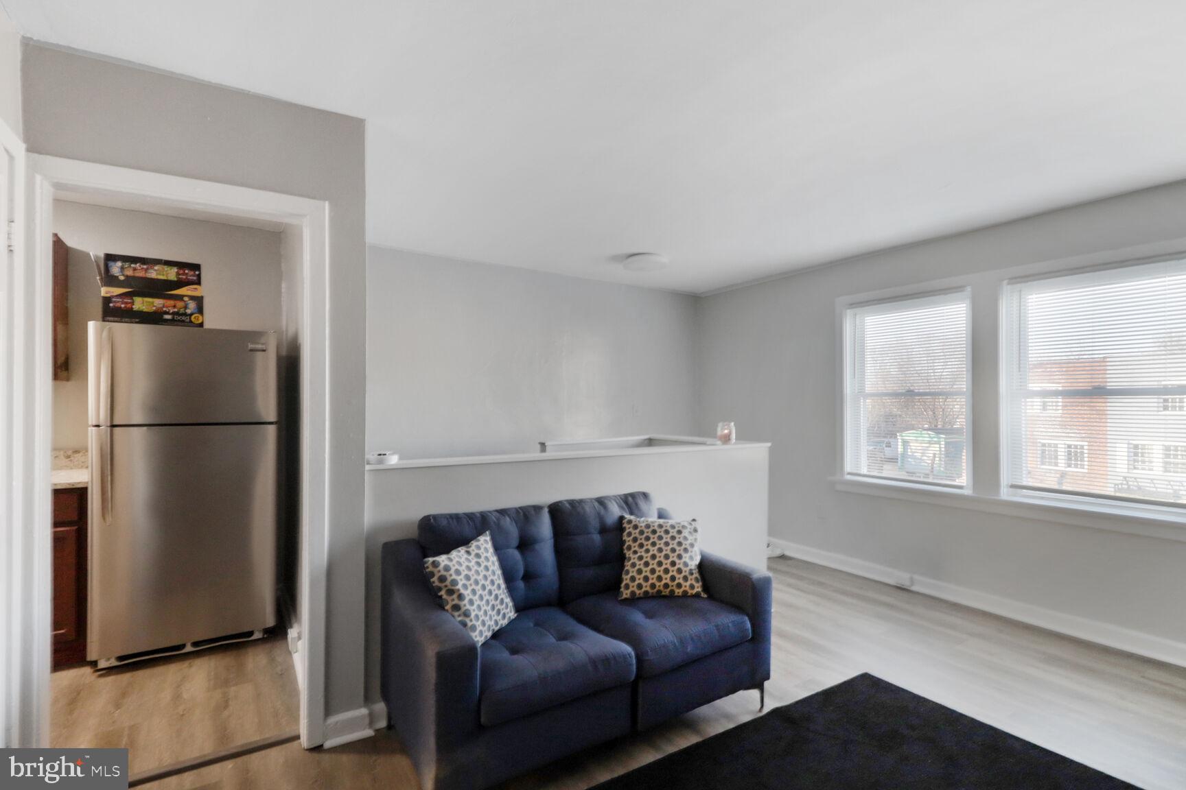 823 Stoll Street Brooklyn, MD 21225 - Photo 15 of 21 a living room with furniture and a window