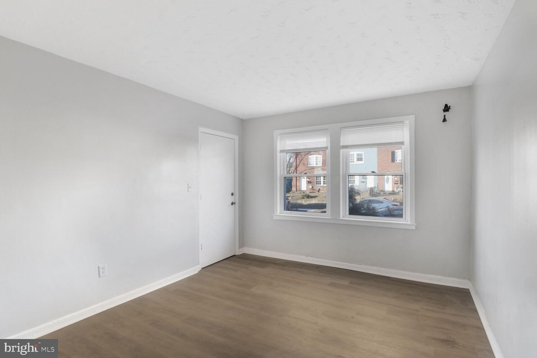 823 Stoll Street Brooklyn, MD 21225 - Photo 2 of 21 an empty room with a window