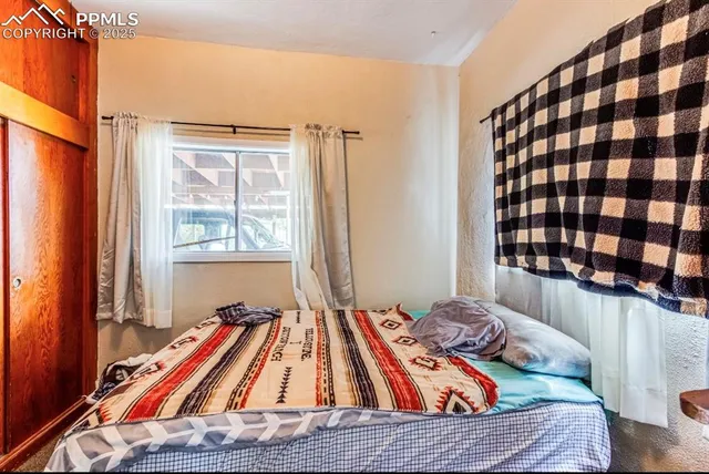 a bed room with furniture and a table