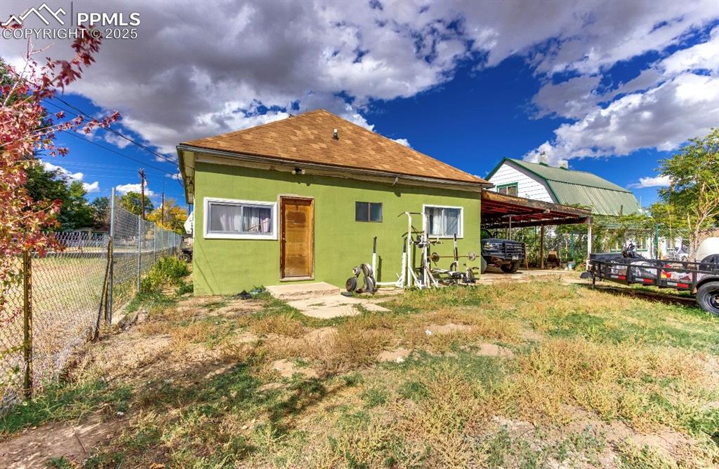 129 West 9th Street Walsenburg, CO 81089 - Photo 23 of 23 a front view of a house with a garden and yard