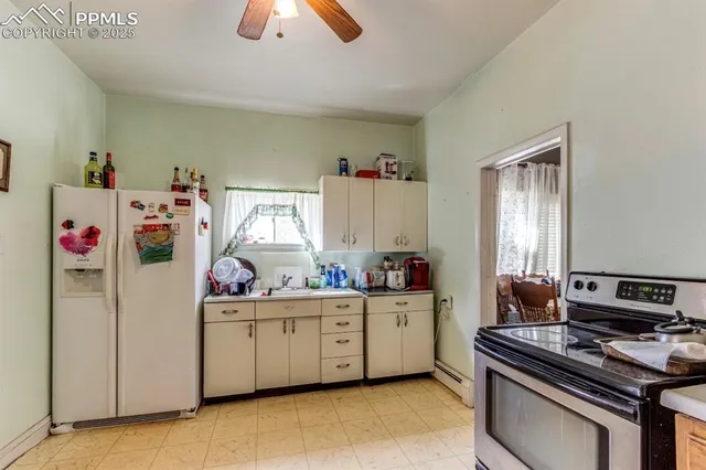 a kitchen that has a sink and a stove